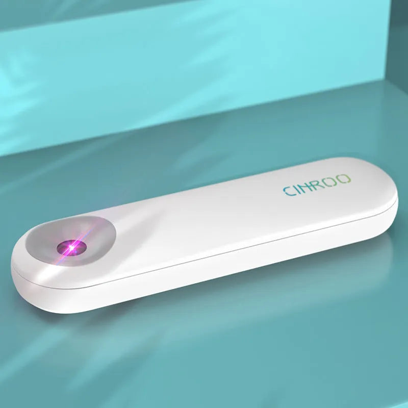 White Spot portable ultraviolet steriliser lamp showing compact dimensions next to a mobile phone for scale.
