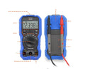 Handheld digital multimeter with display showing readings, test leads, and NCV non-contact voltage detection feature.