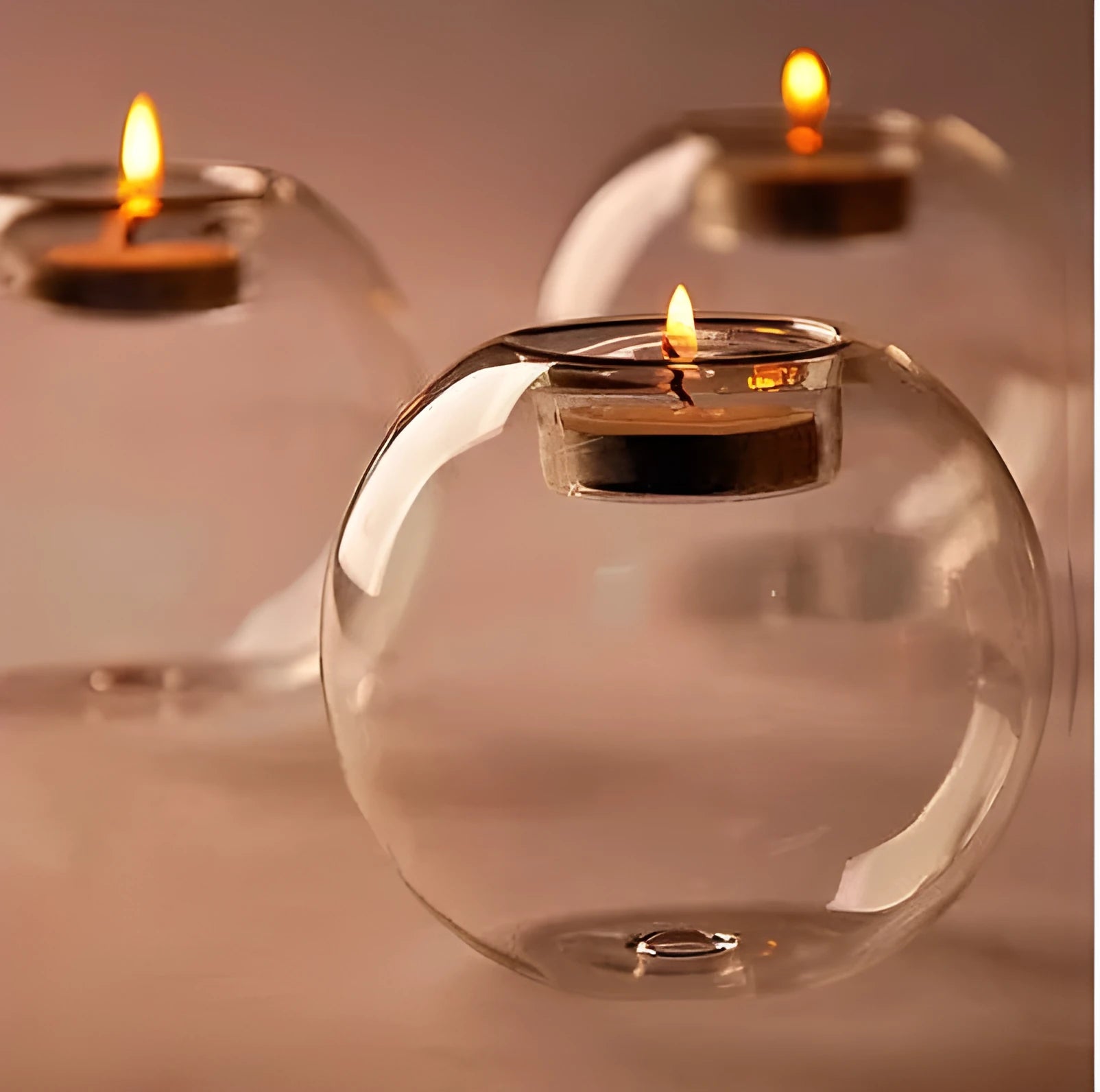 Clear round handmade hollow glass candle holder in three size options