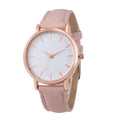 Rectangular analogue quartz watch with PU leather strap on a wrist, showing the alloy case.