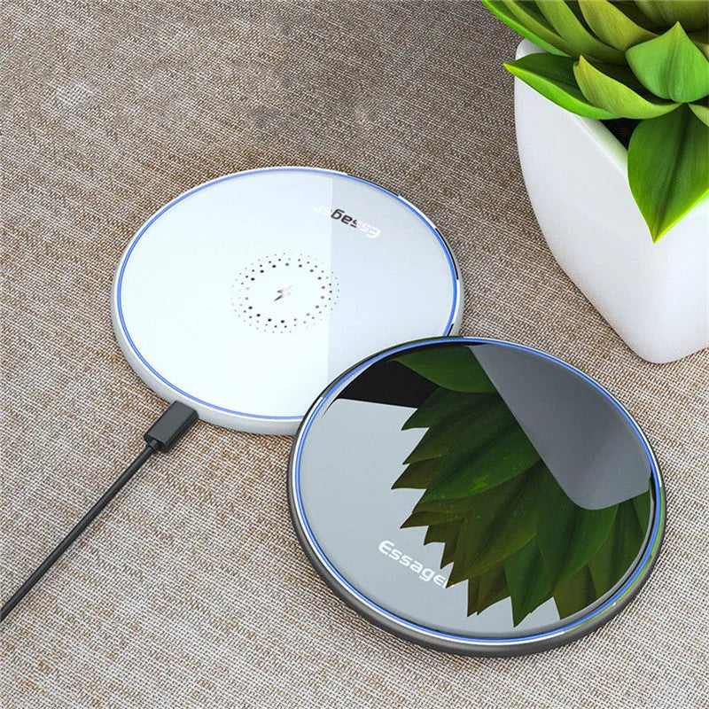 Black wireless charging pad with LED indicator light for smartphones and headphones
