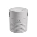 Slim white USB rechargeable humidifier with water tank and colour LED lighting on wooden bedside table