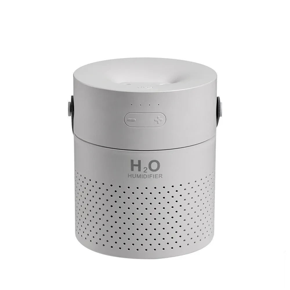 Slim white USB rechargeable humidifier with water tank and colour LED lighting on wooden bedside table