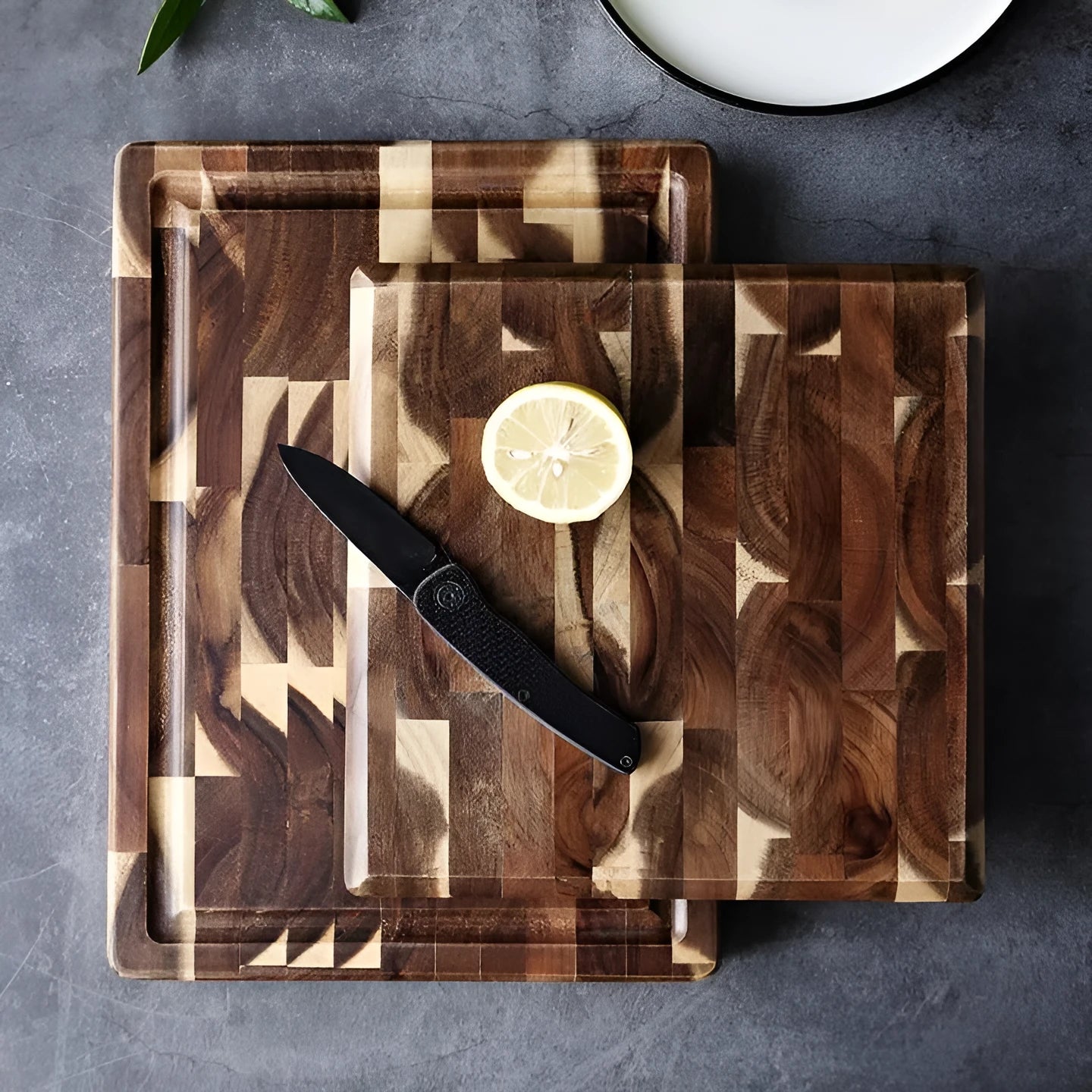 Brown solid acacia wood chopping board with 3cm thickness on a kitchen countertop