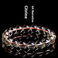 Natural citrine scattered beads bracelet showing polished gemstone beads on a cord.