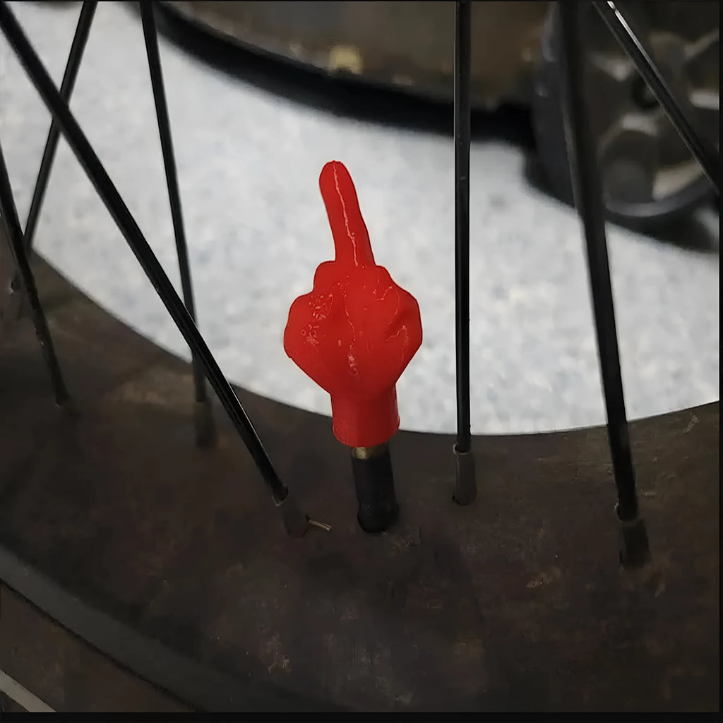 Eight latex car tyre valve caps showing black and skin colour pieces for tyre pressure maintenance