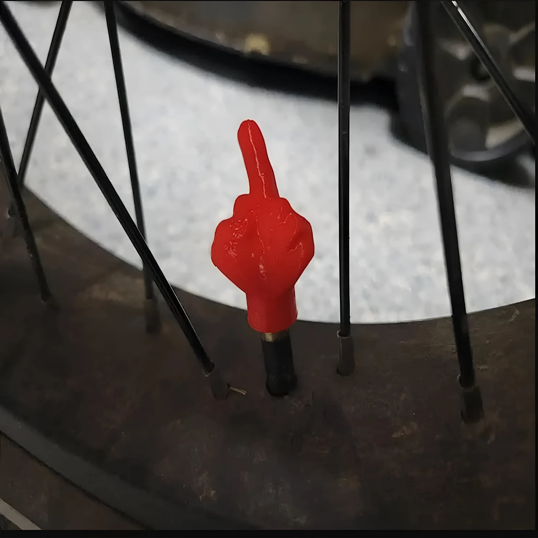 Eight latex car tyre valve caps showing black and skin colour pieces for tyre pressure maintenance