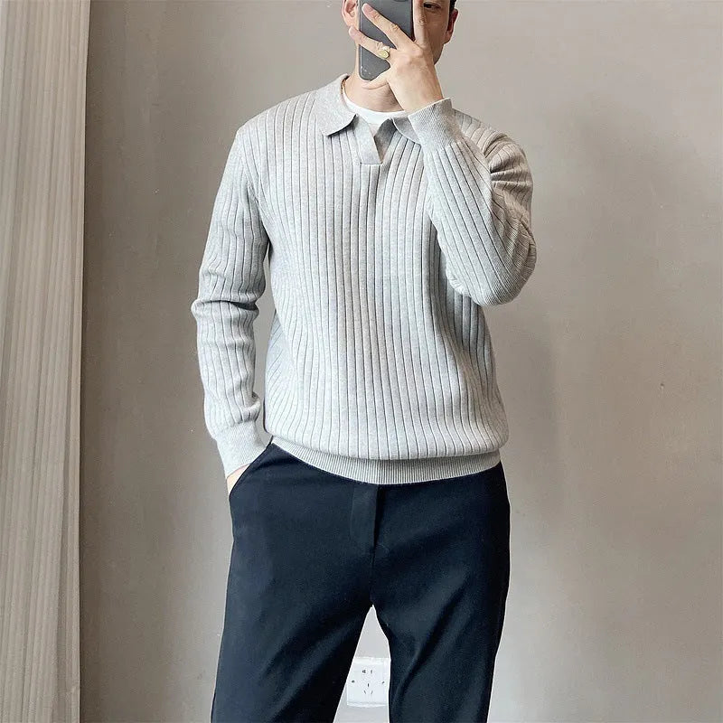 Men's loose grey knitted sweater with a textured striped lapel, shown on a model.