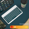 Bluetooth keyboard and rechargeable mouse set for tablet and PC on a desk.