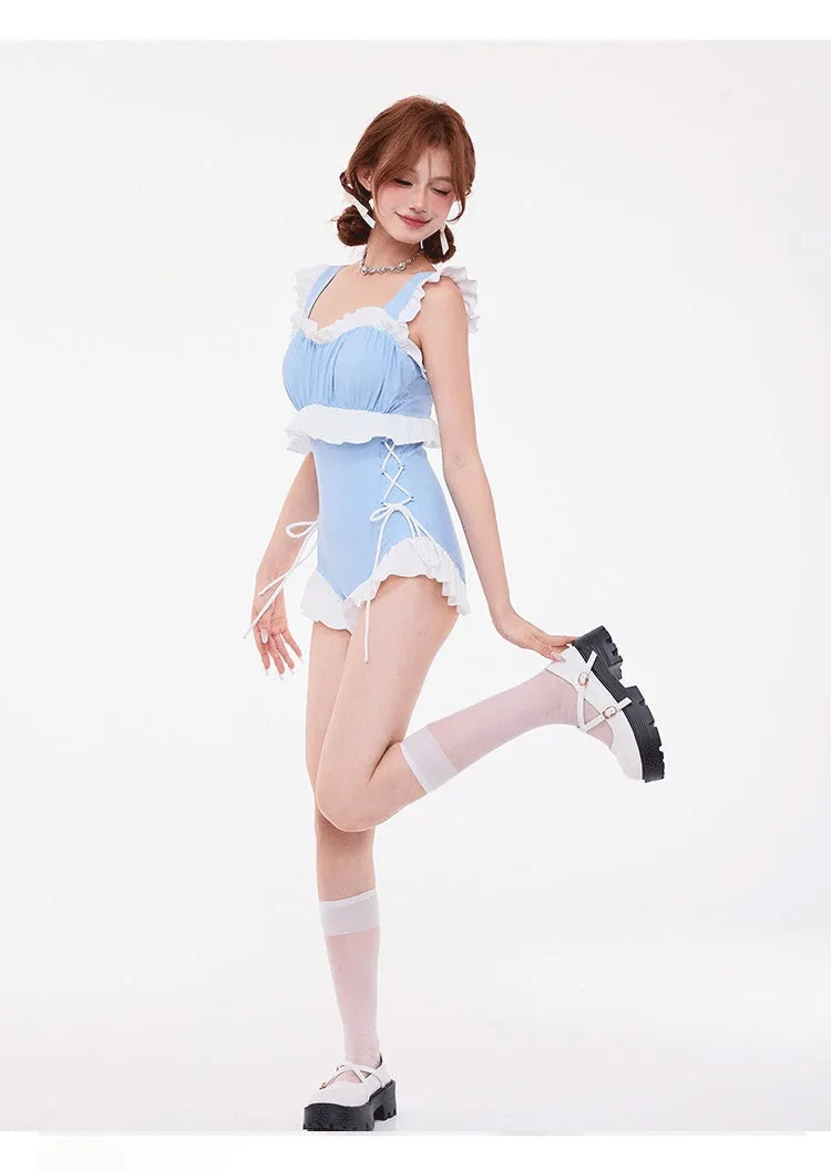 Light blue women's one-piece swimsuit with high waist, backless design, and lace detailing