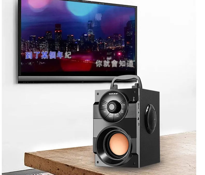 Black portable mini home audio system with subwoofer showing front speakers and connection ports