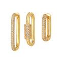 Three geometric square ear clips with inlaid zircon stones in gold and white gold colours
