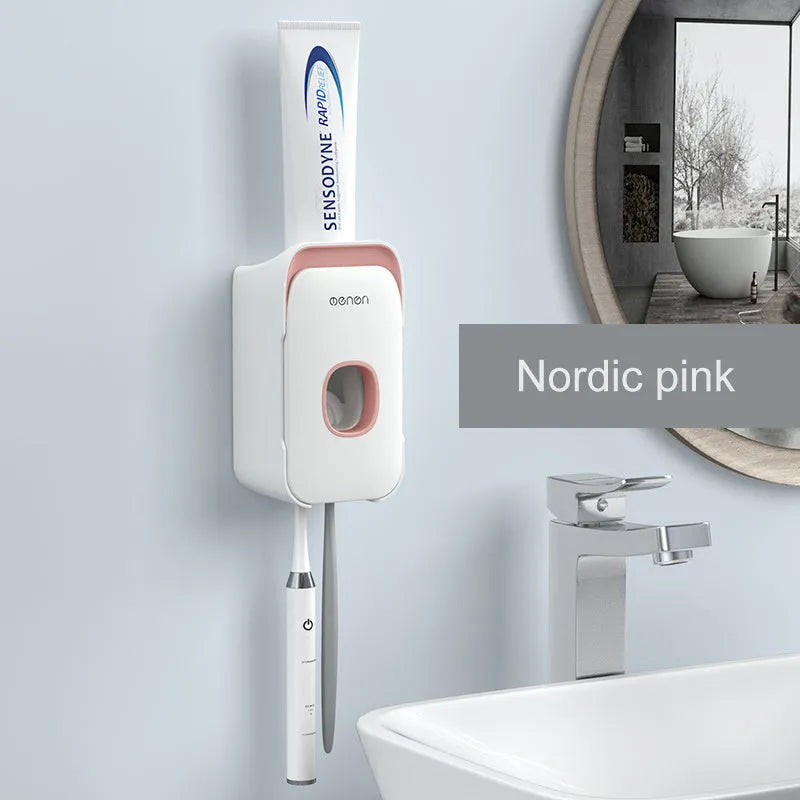 Blue automatic toothpaste dispenser with wall-mount bracket on a bathroom wall