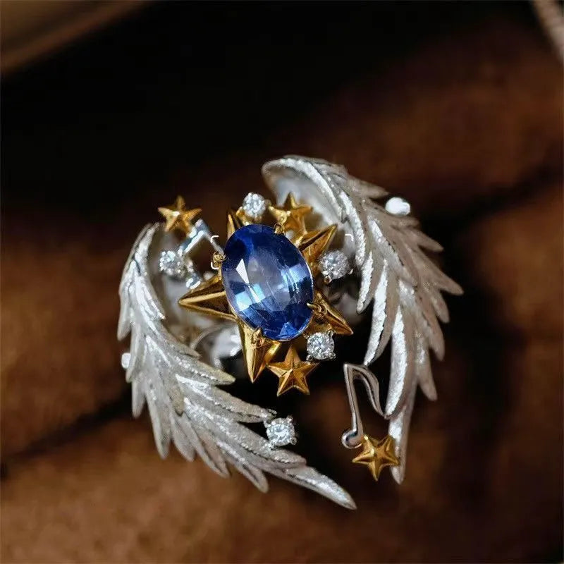 Adjustable ring with geometric angel wings pattern and open mouth design