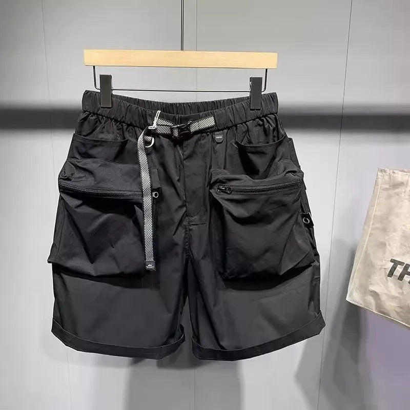 Men's loose fit black casual shorts with large side pockets and an elasticated waistband.