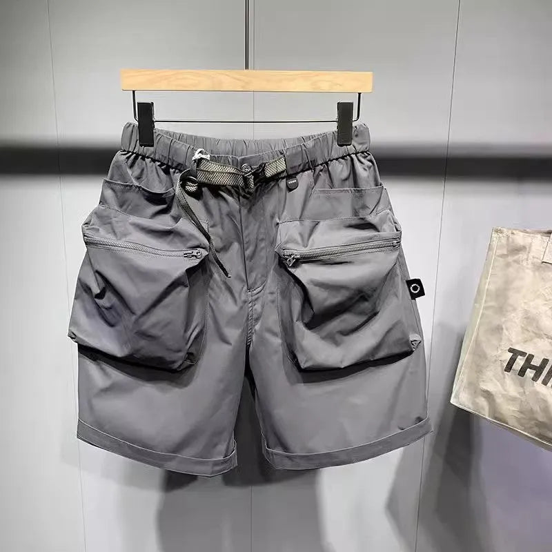 Men's loose fit black casual shorts with large side pockets and an elasticated waistband.