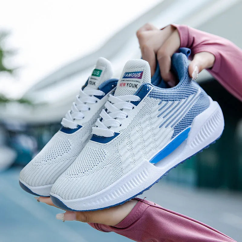 Men's blue breathable mesh casual shoes with round toe and plastic sole on a white background.