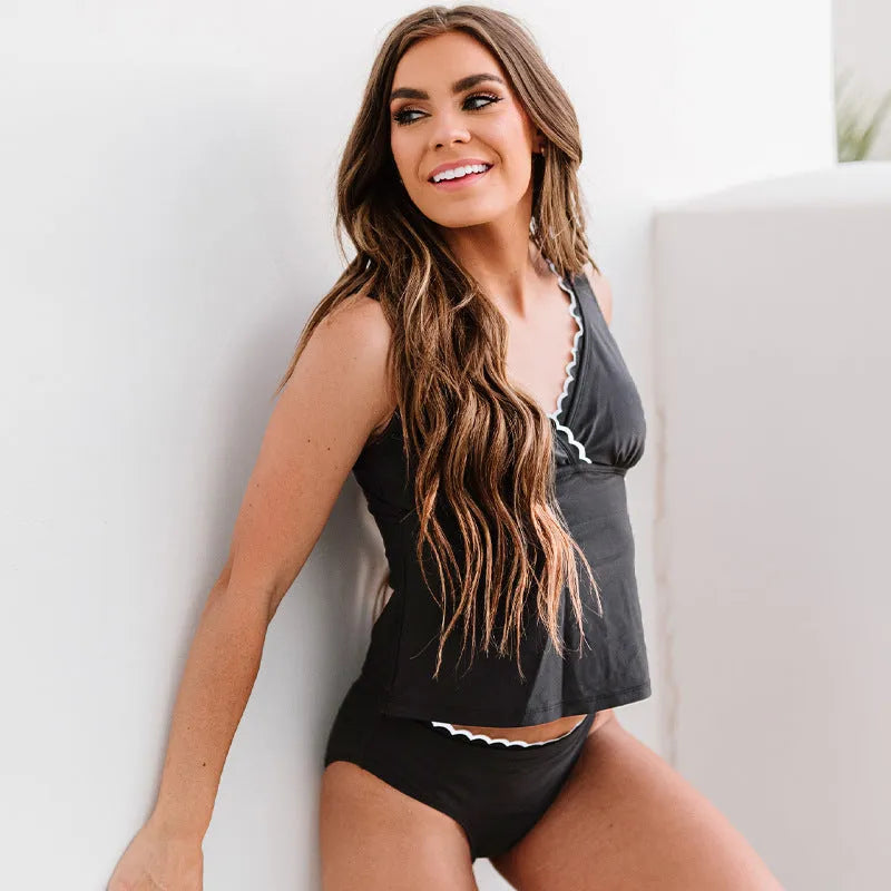 Black women's one-piece swimsuit with sleeveless design and solid colour