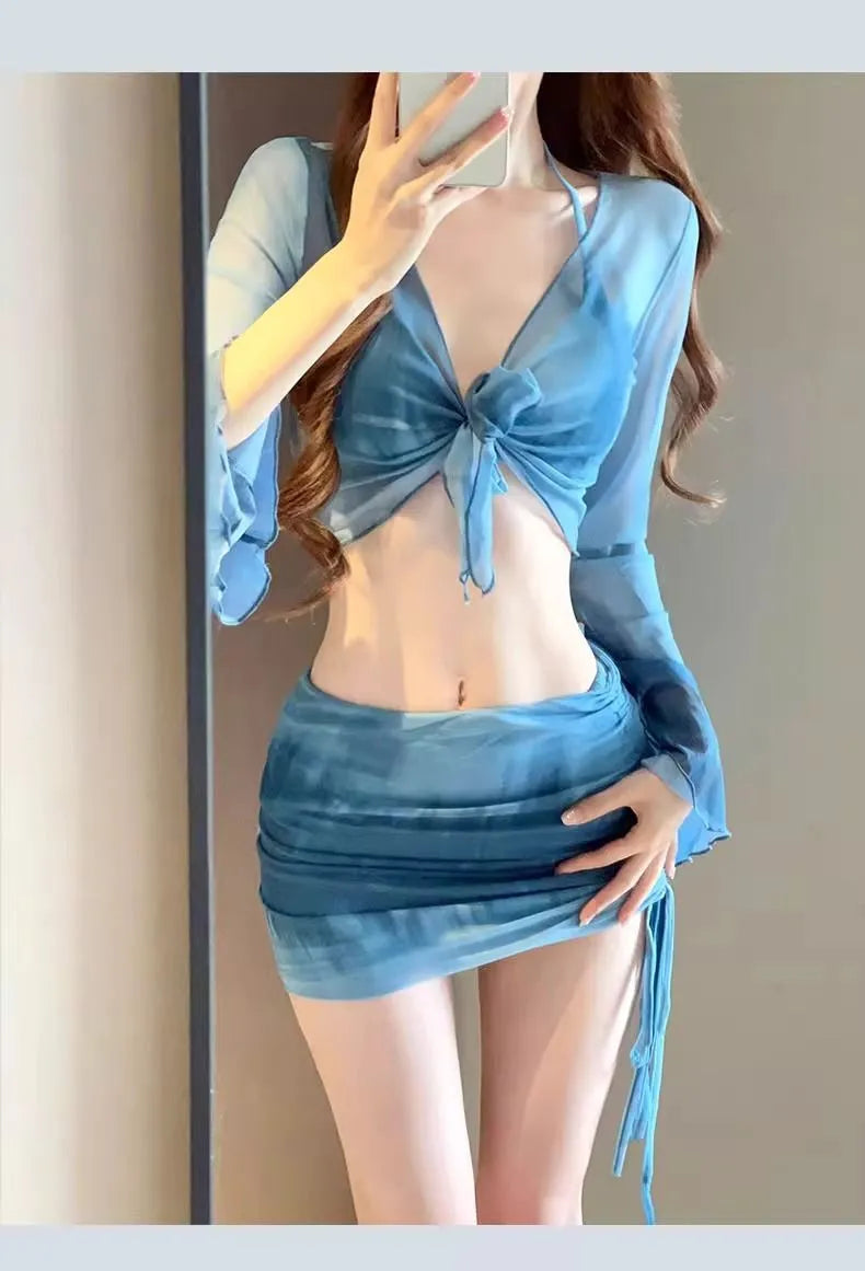 Blue women's four-piece bikini swimsuit set with high-waist briefs and a backless top.
