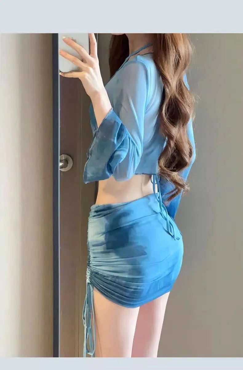 Blue women's four-piece bikini swimsuit set with high-waist briefs and a backless top.