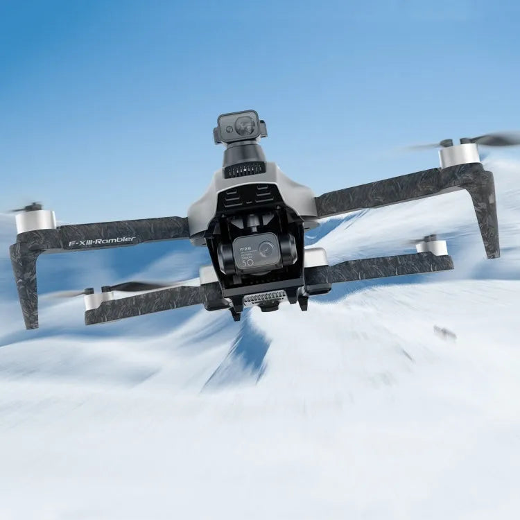 White folding quadcopter drone with camera and propeller guards, shown alongside remote control and shoulder bag.