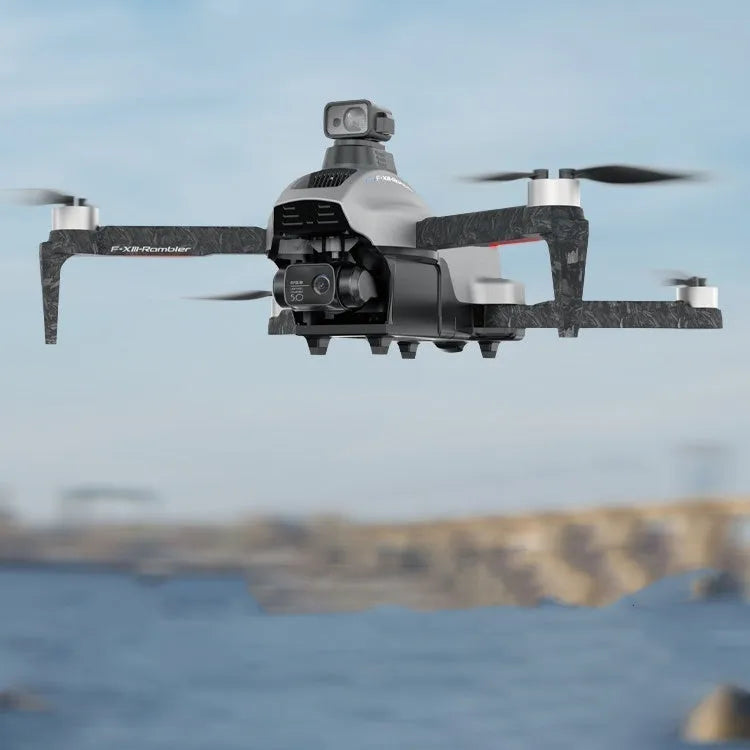White folding quadcopter drone with camera and propeller guards, shown alongside remote control and shoulder bag.