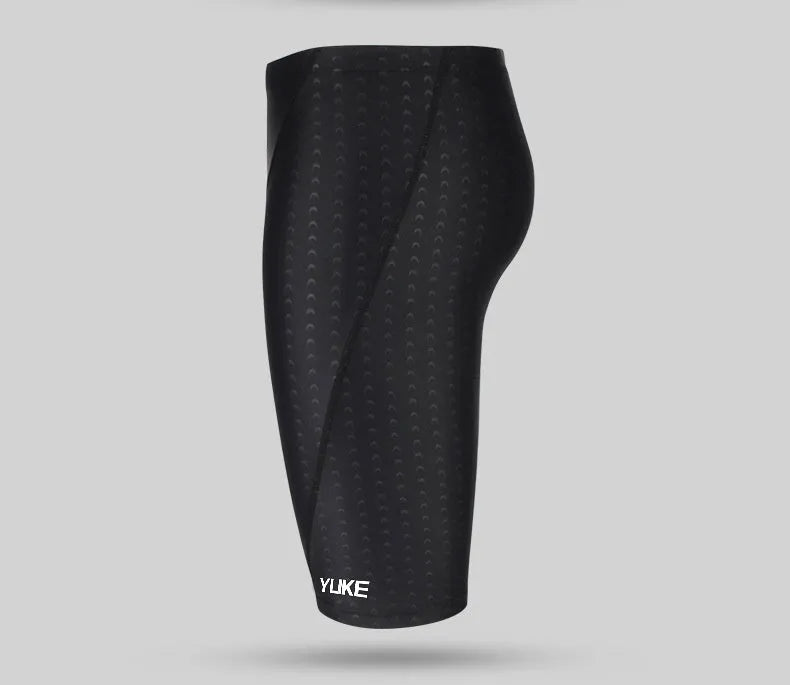 Men's black swimming set with trunks, anti-fog goggles, waterproof cap, ear plugs with nose clip, and storage bag