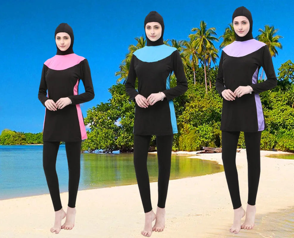 Conservative women's swimsuit with long sleeves and hood in black with coloured accents