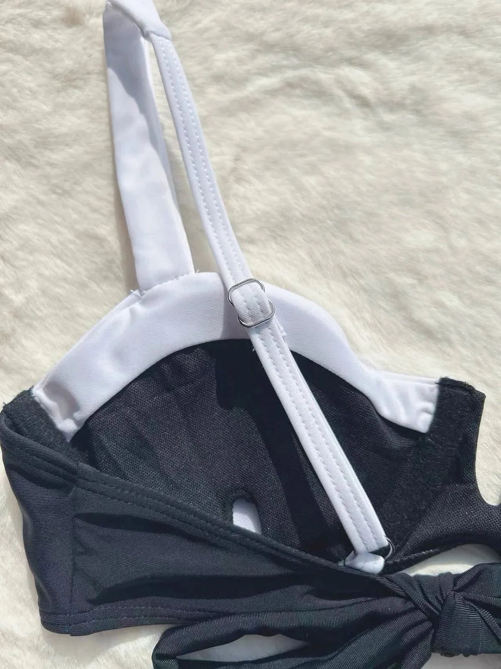 Black low waist women's bikini swimsuit briefs with split stitching detail