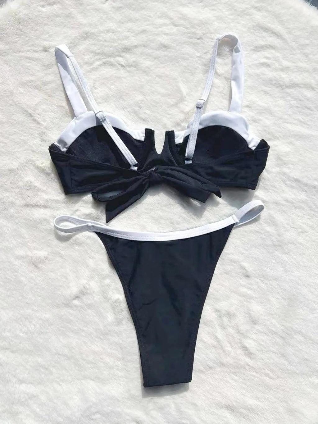 Black low waist women's bikini swimsuit briefs with split stitching detail