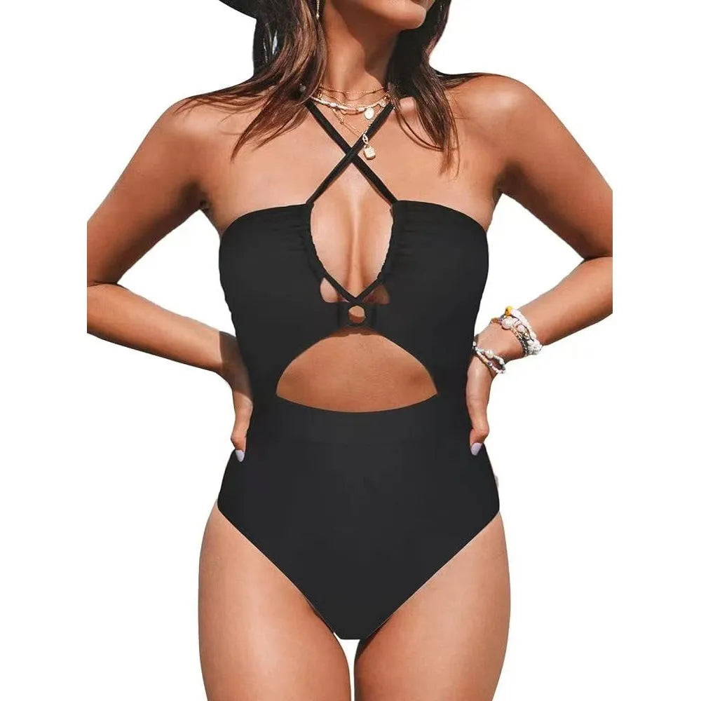 Solid colour women's one-piece swimsuit with a cross-back backless design, shown in black.