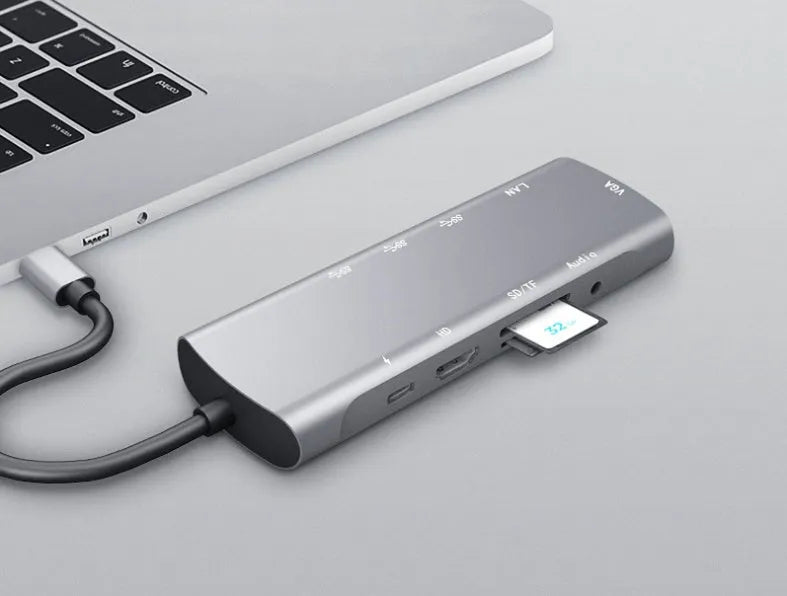 Grey USB-C docking station with aluminium alloy shell and 140mm cable showing HDMI and VGA ports