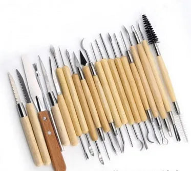 27-piece pottery clay tool set with stainless steel, wooden, and plastic tools rolled in a protective case.