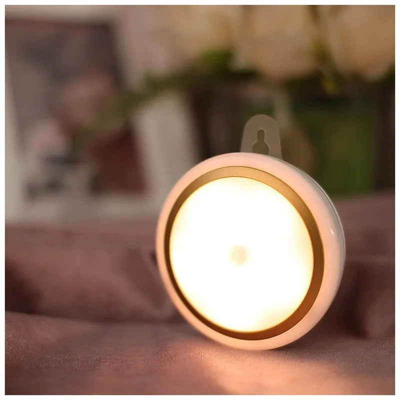 Smart battery-powered motion sensor LED light with infrared sensing on a white background.