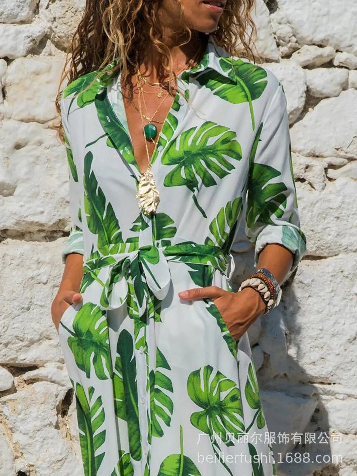 Women's white V-neck chiffon dress with printed A-line skirt and high waist on a hanger.