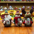 Red, green, and white flannel Christmas hanging decoration showing snowman, reindeer, and Father Christmas designs.