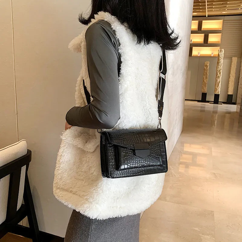 Vintage PU leather crossbody bag in black showing 20cm width and crossbody strap