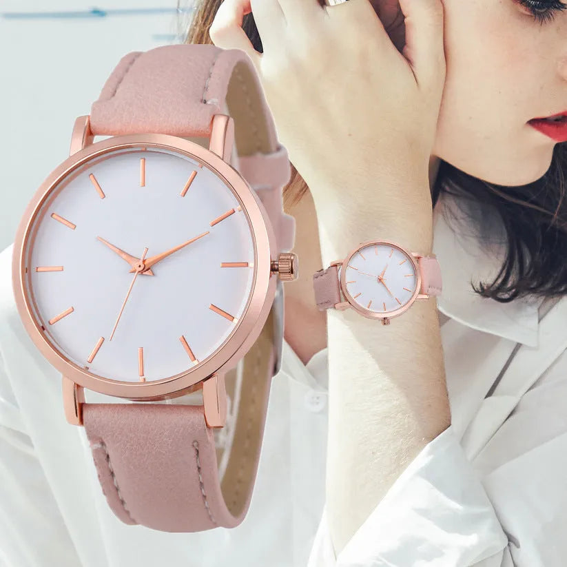 Rectangular analogue quartz watch with PU leather strap on a wrist, showing the alloy case.