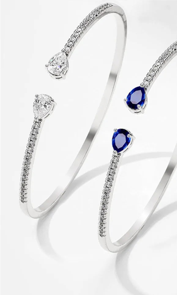 Copper bracelet with zircon inlay treatment in blue colour option