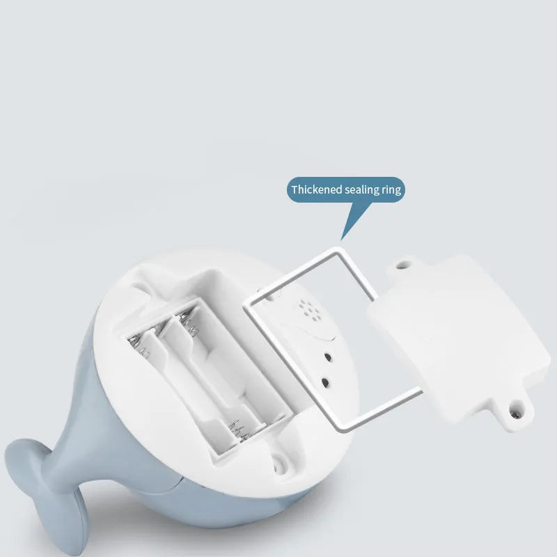 Automatic electric whale bath toy spraying water with flashing coloured lights