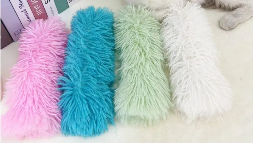 Rectangular blue plush cat toy pillow measuring 27cm long by 10cm wide.