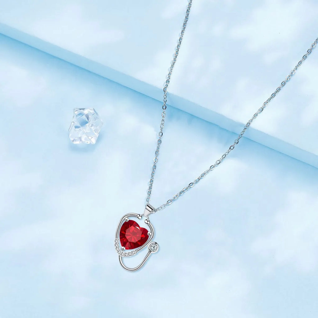 Women's copper stethoscope pendant necklace with wings cross design and red diamond electroplated finish