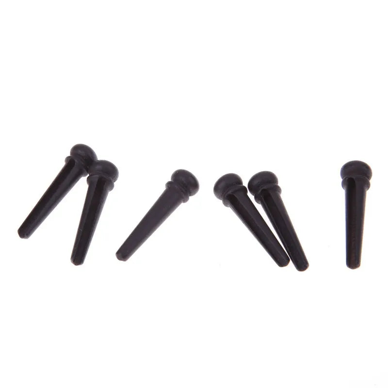 Six ebony guitar string nails with matt black finish for folk acoustic guitars