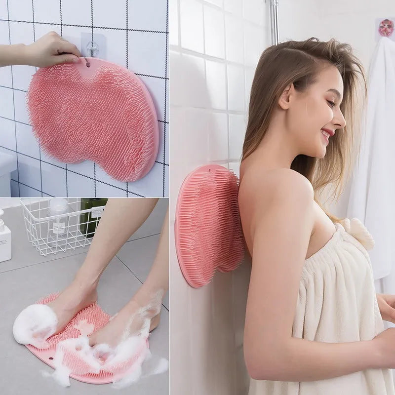 Orange non-slip silicone bath massage mat with suction cups on a bathroom floor.