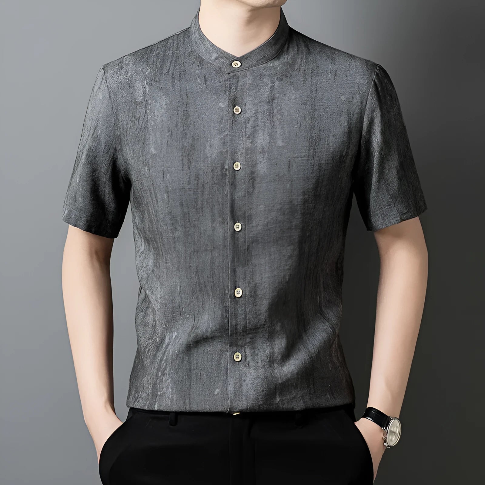 Men's loose fit linen shirt in solid colour with stand collar, shown in black grey.