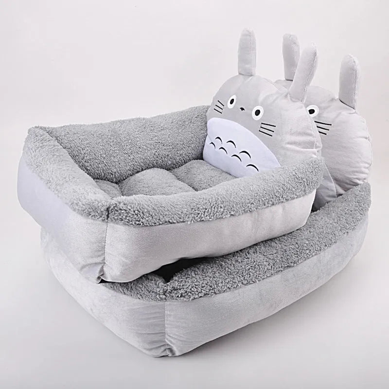 Blue cartoon-style soft plush pet bed sofa for a small dog, with raised sides.