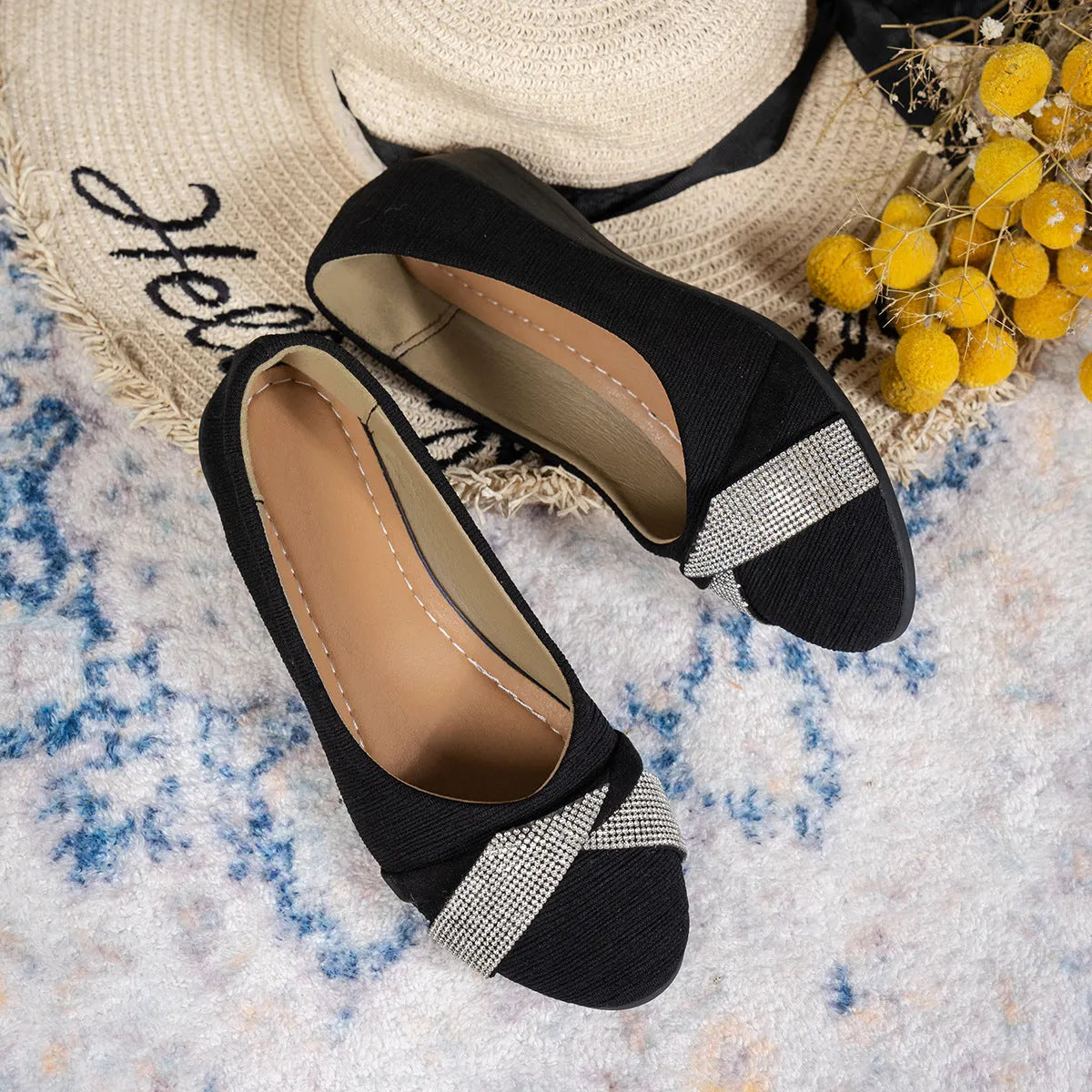 Black women's slip-on casual shoes with rhinestones on the toe and a chunky heel.