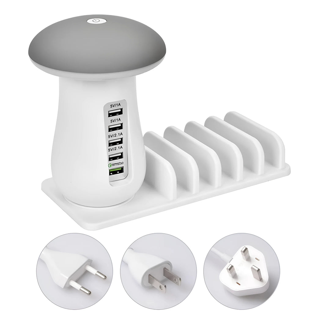 White mushroom-shaped LED desk lamp with a 5-port USB charging station at its base on a wooden table.