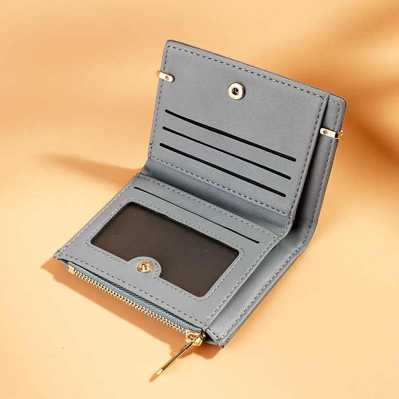Open view of a ladies PU leather zipper wallet showing multiple card slots, a bill holder, and a change compartment.