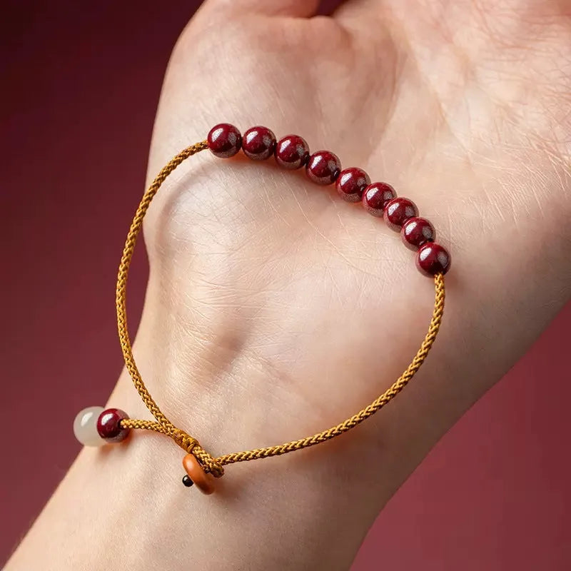 Hand-woven cinnabar bracelet with geometric design and traditional Chinese style
